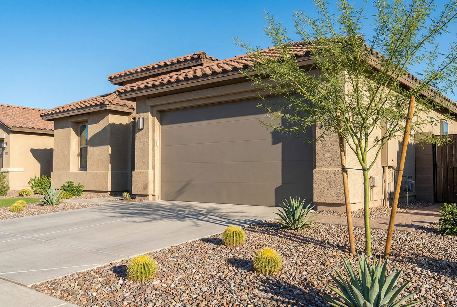 Modern garage door on a Gilbert, AZ home with desert landscaping