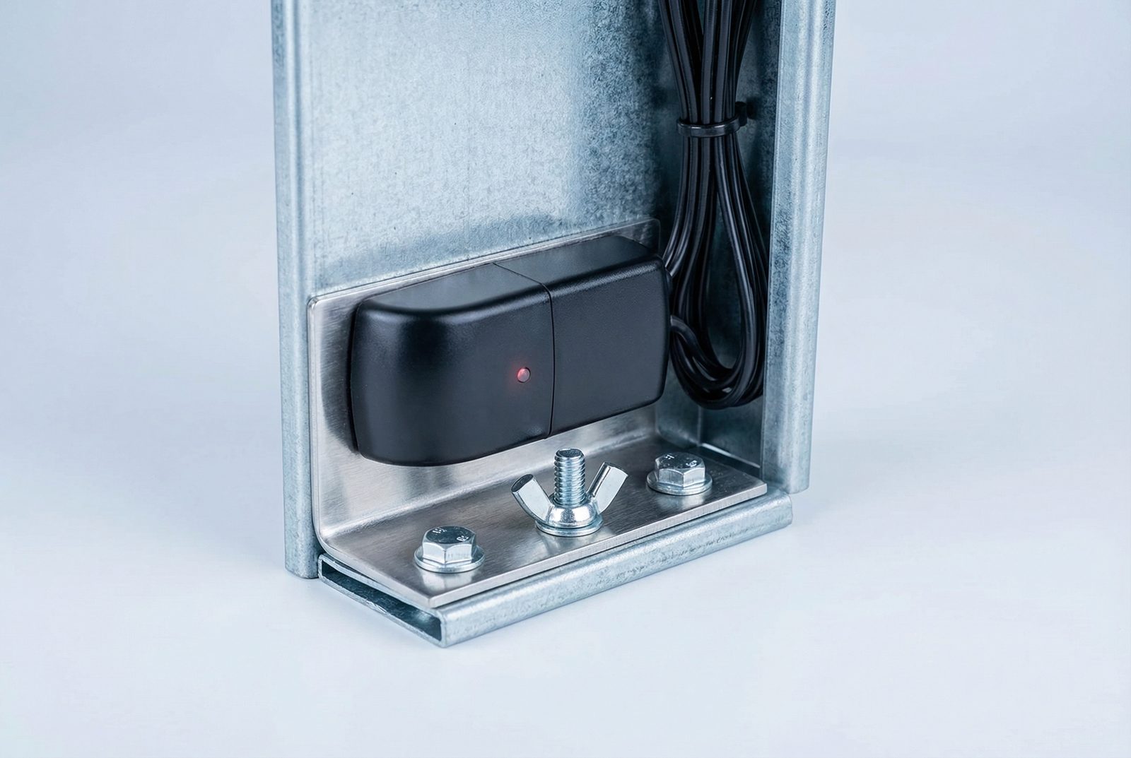 Garage door sensor bracket mounting hardware showing proper 6-inch height installation on the door track